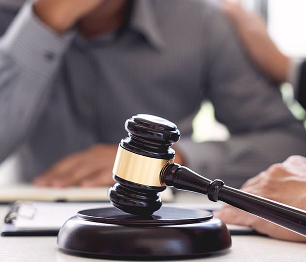 Gavel on a table symbolizing the concept of settlement and residence rights.